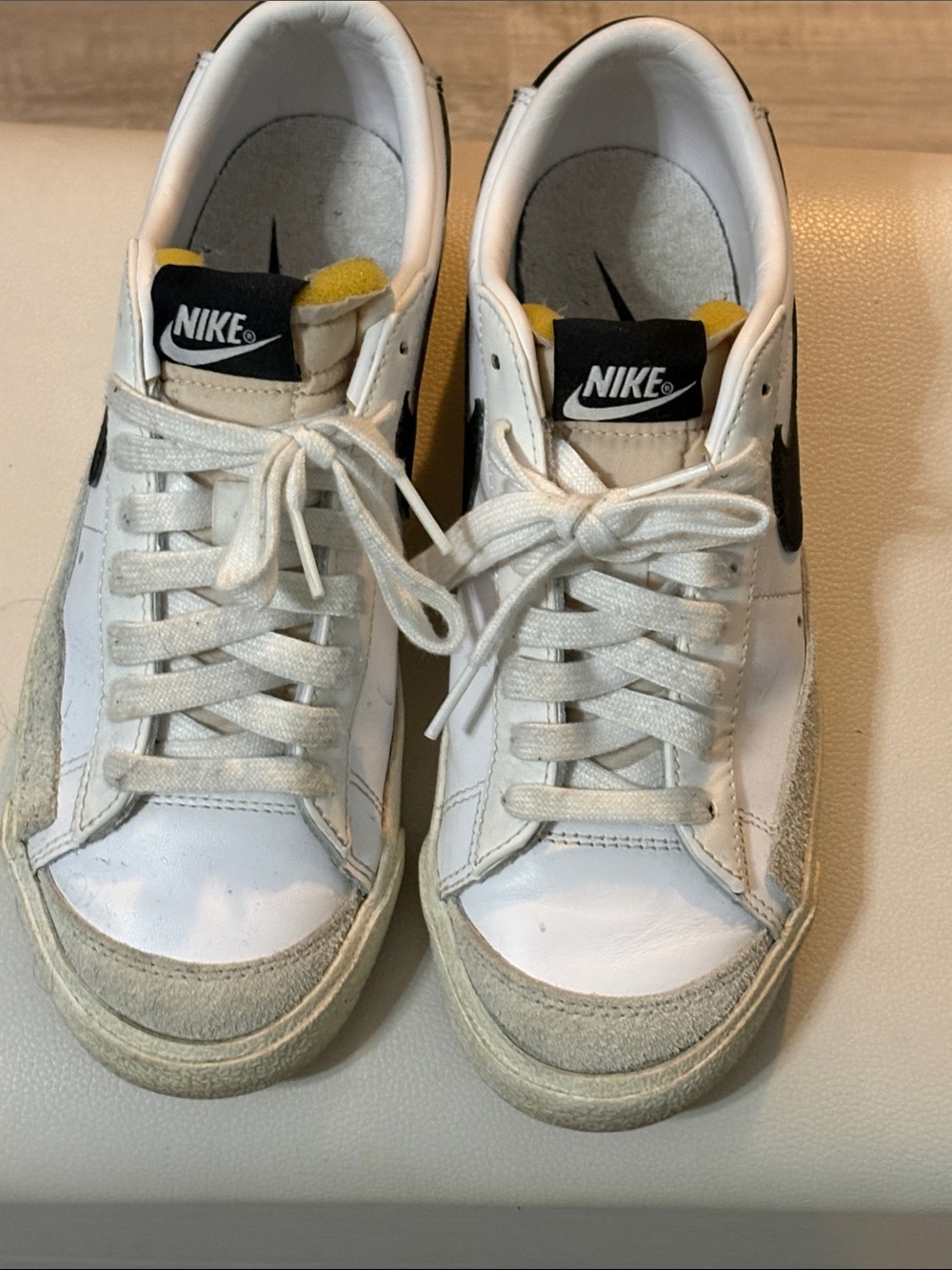 Nike Kids White Sneakers with Black Swoosh and Yellow Tongue Accent